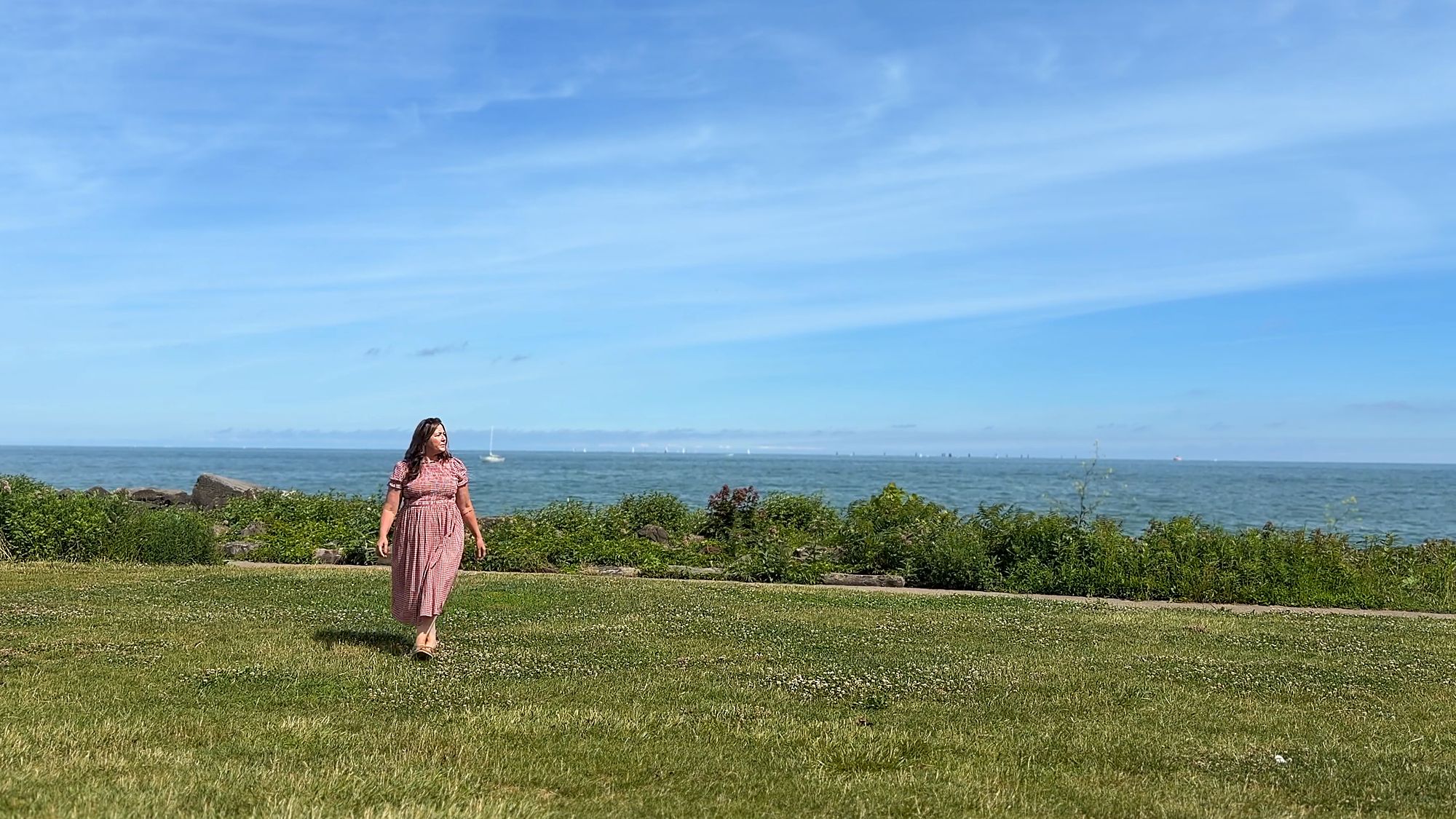 Traci Taylor walking along the Lake Erie shoreline