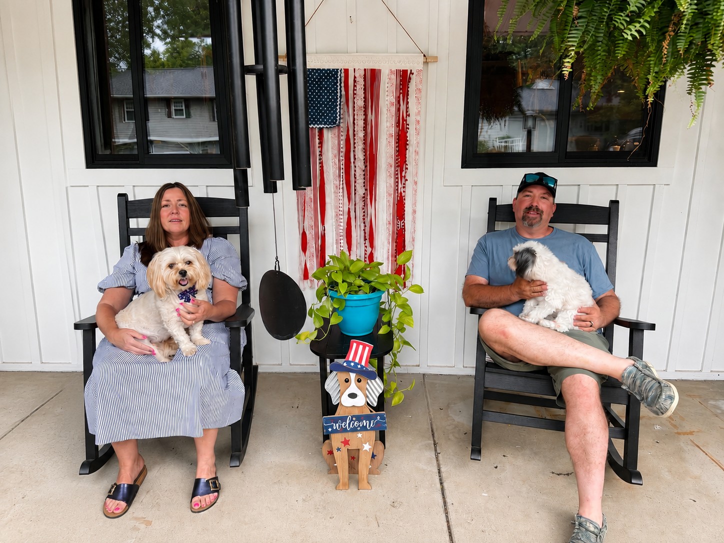 Traci Taylor and her husband Dave relaxing on their front porch with their dogs Doug and Lily