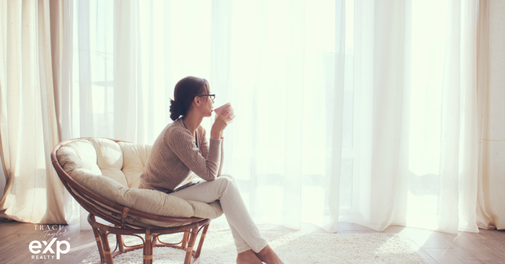 Woman sitting thoughtfully in living room of family home Northeast Ohio