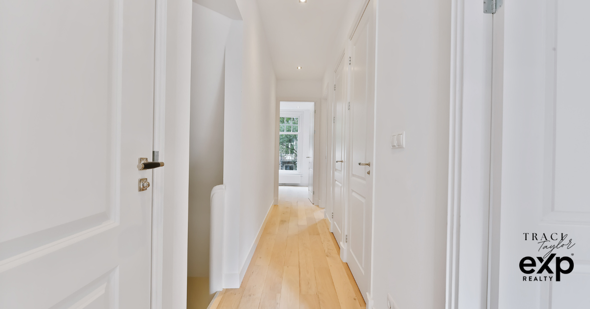 Sunlit hallway of family home with open bedroom doors Northeast Ohio